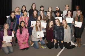 Group of students who won Scholastic Art Awards holding their certificates.