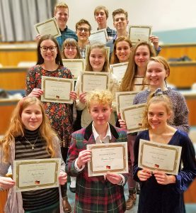 This is an image of the German Honor Society members holding certificates and smiling