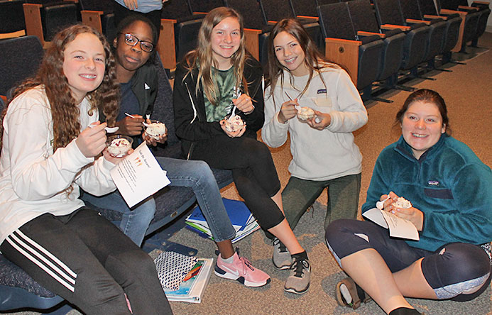 This is an image of a group of female students eating ice cream