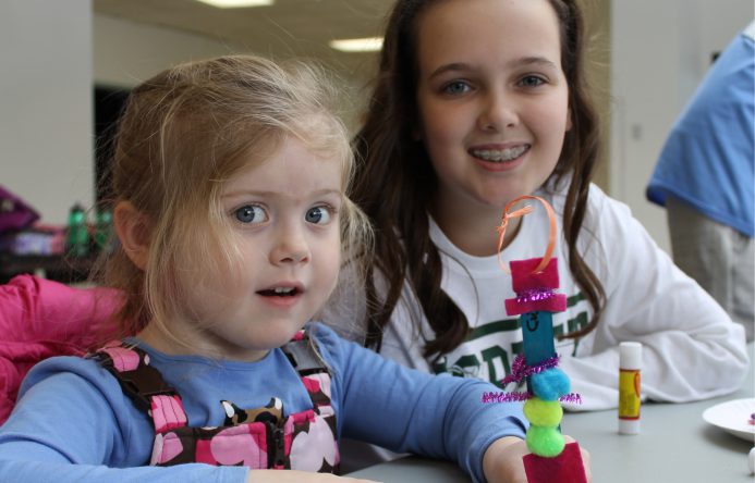 This is an image of two female students smiling