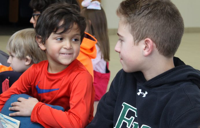 This is an image of two students looking at each other