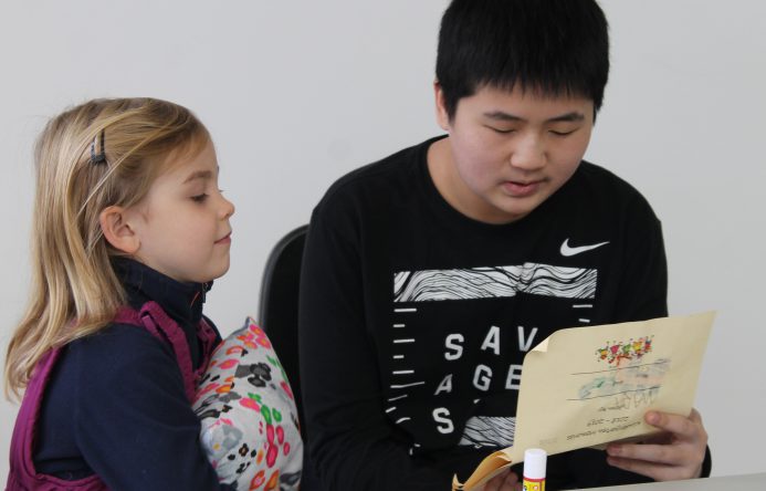 This is an image of two students reading together