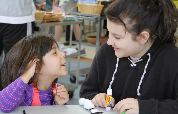 This is an image of two students looking at each other