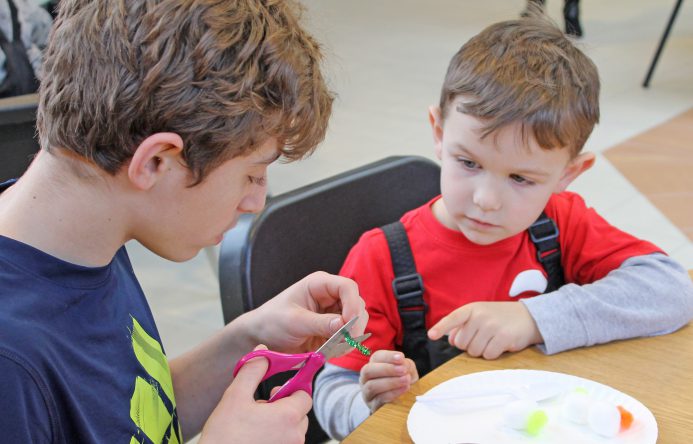 This is an image of two students sitting at a table