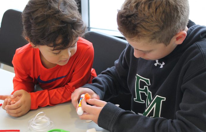 This is an image of two students working together