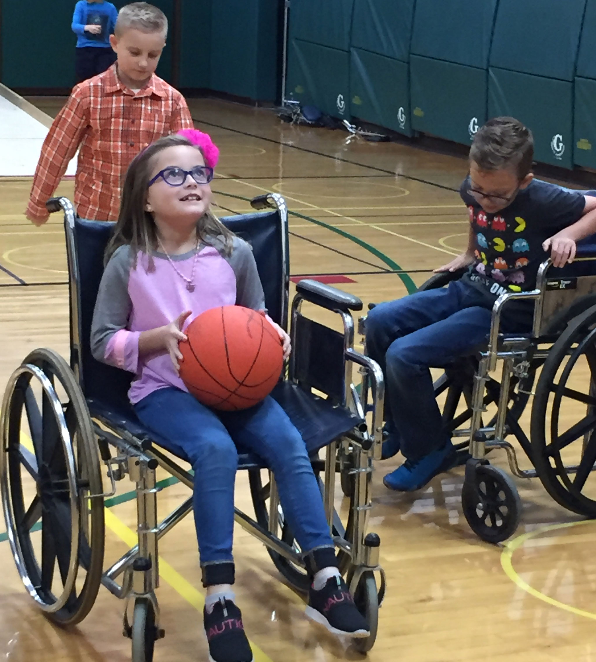 This is an image of a female student maneuvering a wheelchair