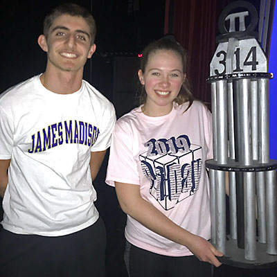 This is an image of Becca Ziobro and Jack Hannah holding the Pi Day trophy