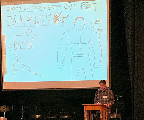 This is an image of author Nathan Hale presenting to students
