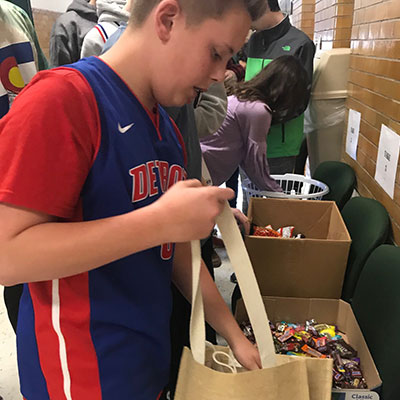 This is an image of a student filling a hospitality bag