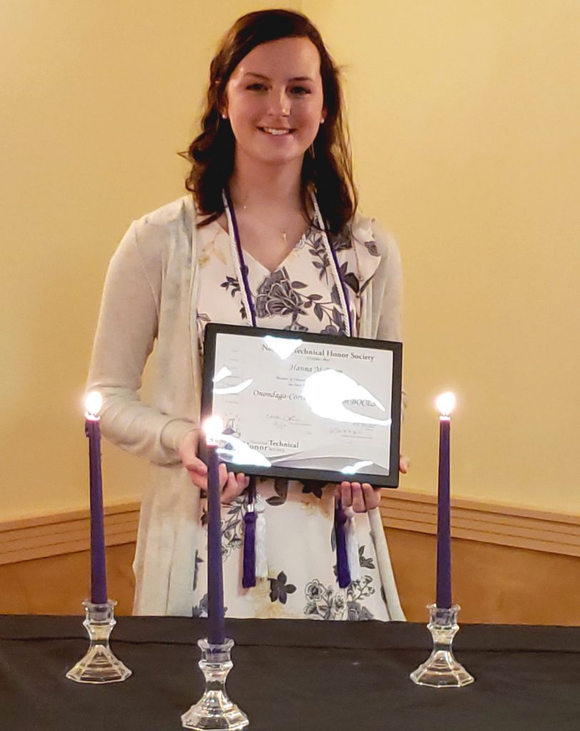 This is an image of Hanna Breen holding a certificate