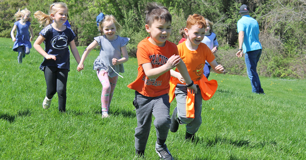 This is an image of three students running