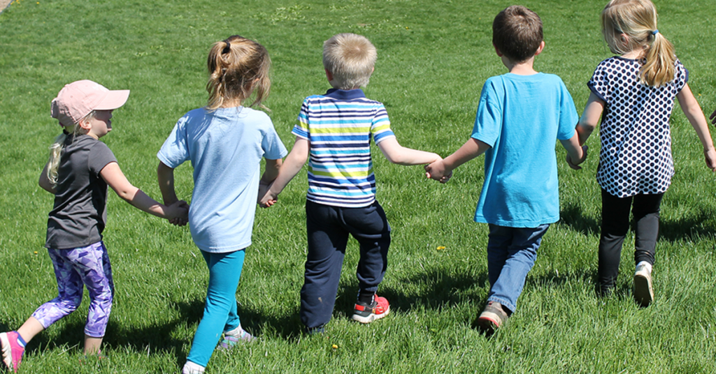 This is an image of students holding hands