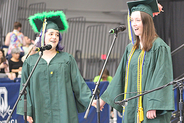 This is an image of two students at graduation