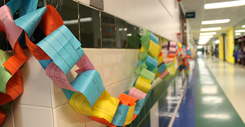 This is an image of a paper chain hanging in a hallway