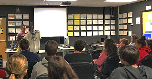 This is an image of Ted Ballard talking to students in a classroom