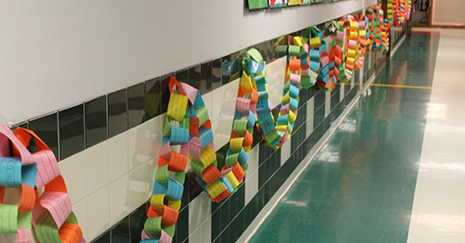 This is an image of a paper chain hanging in a hallway