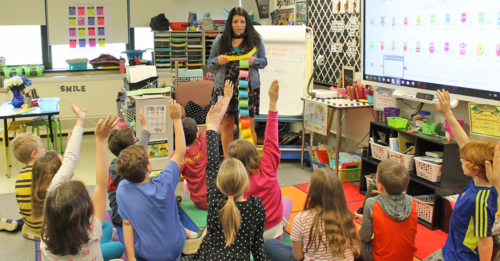 This is an image of students making a paper chain