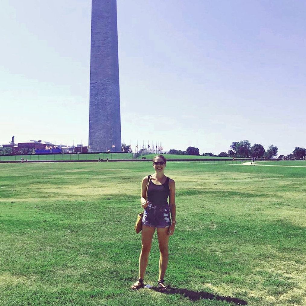 This is an image of Erica Aldrich standing in front of a monument in Washington, D.C.