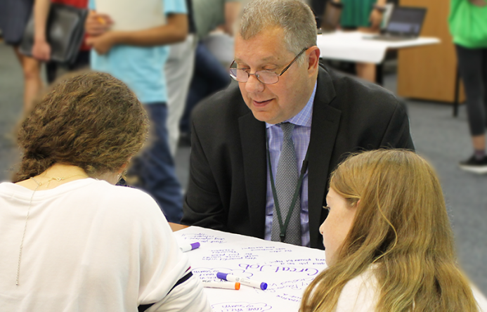 This is an image of Dr. Tice working with students