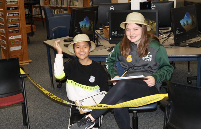 Two students smiling at camera