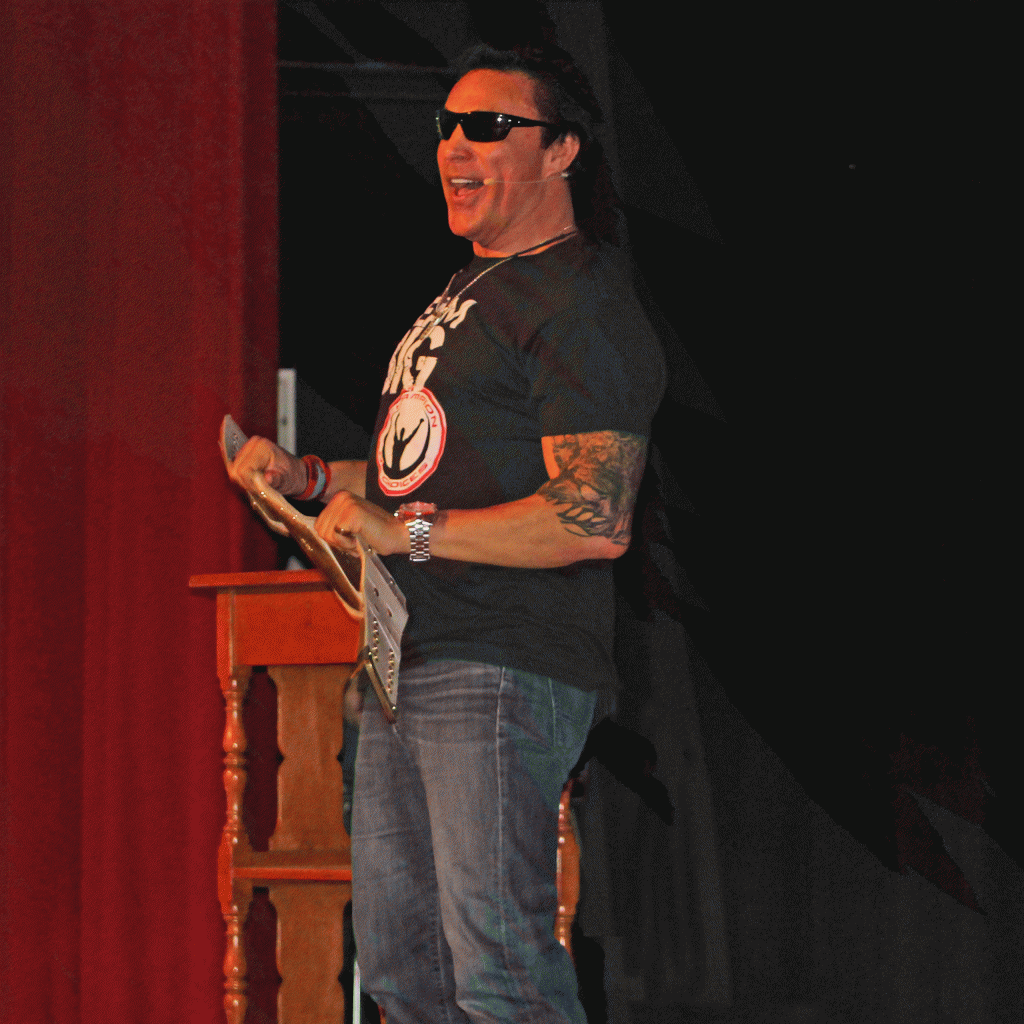 This is an image of Marc Mero talking on stage