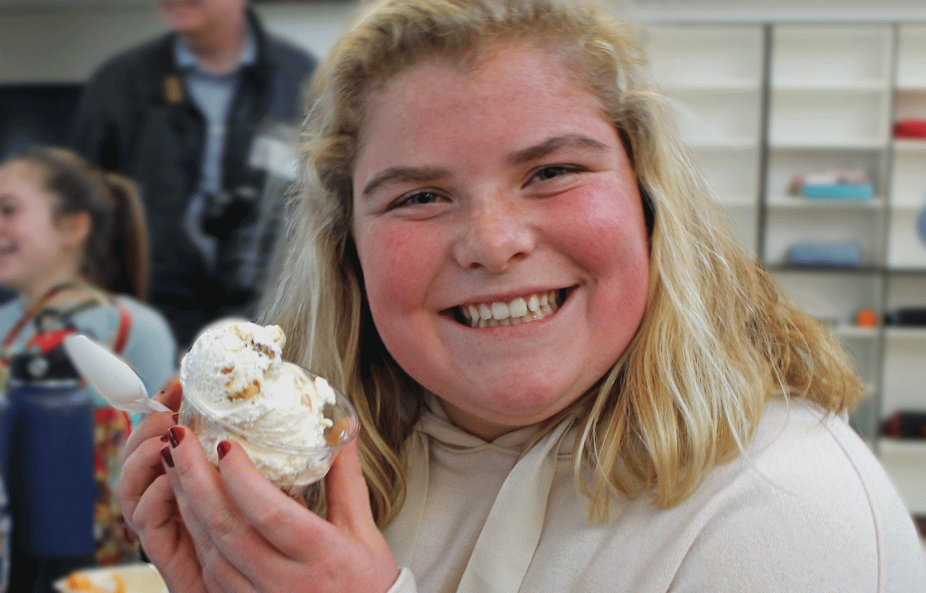 This is an image of a student holding an ice cream