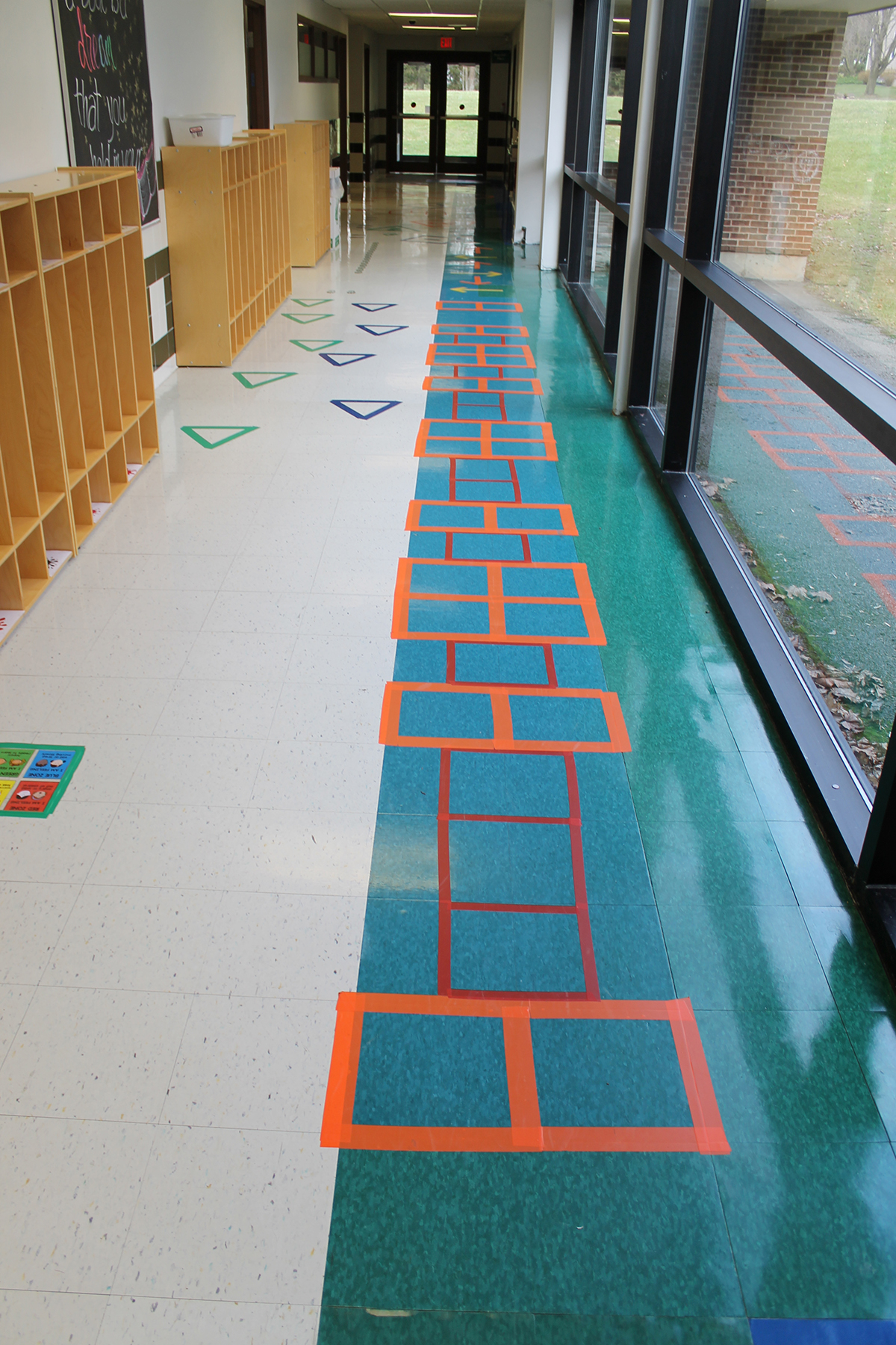 Square stickers on hallway floor