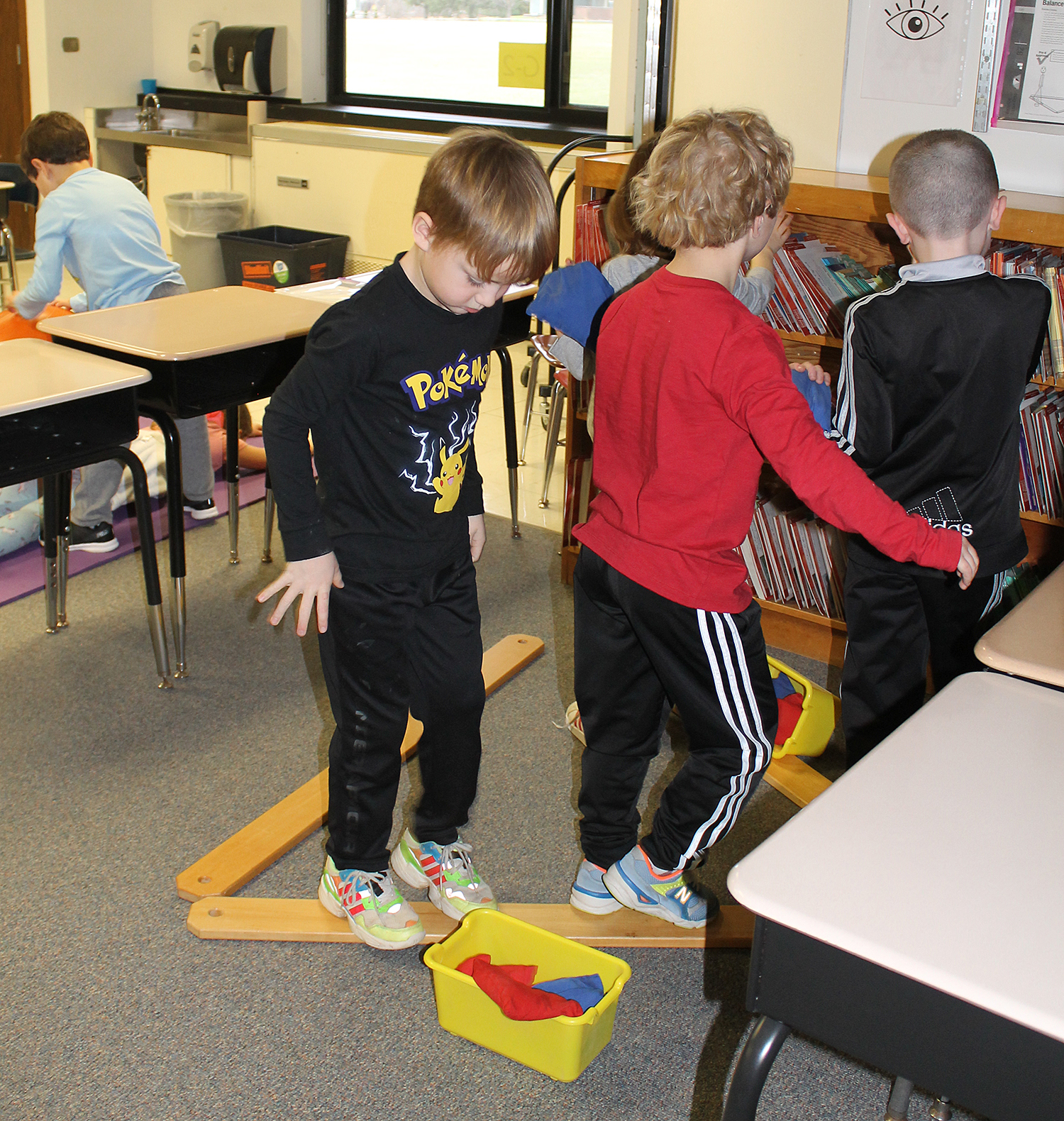 Students following a sticker path.