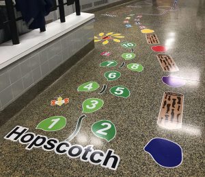 Stickers on hallway floor.