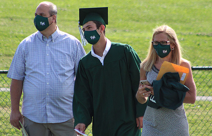 This is an image of a graduate with family members