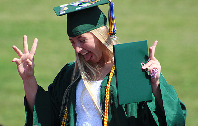 This is an image of a graduate laughing