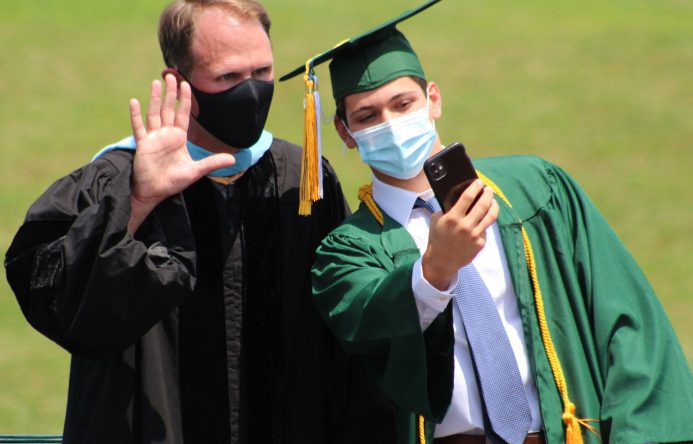 This is an image of a graduate taking a selfie