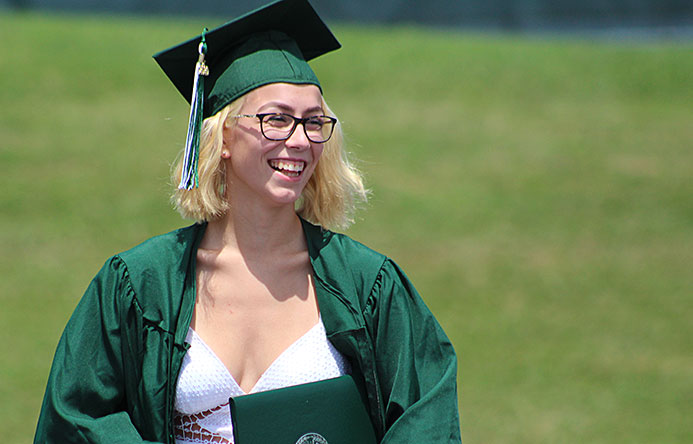 This is an image of a graduate smiling