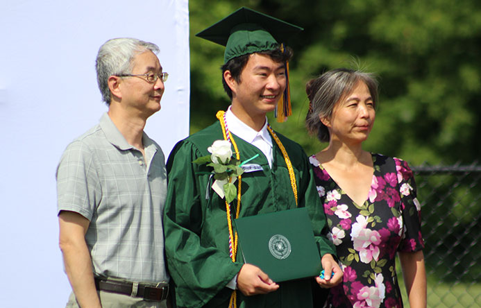 This is an image of a graduate with family members