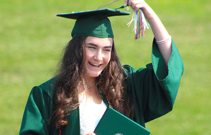 This is an image of a graduate turning her tassel
