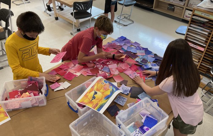 Students sorting colored squares.