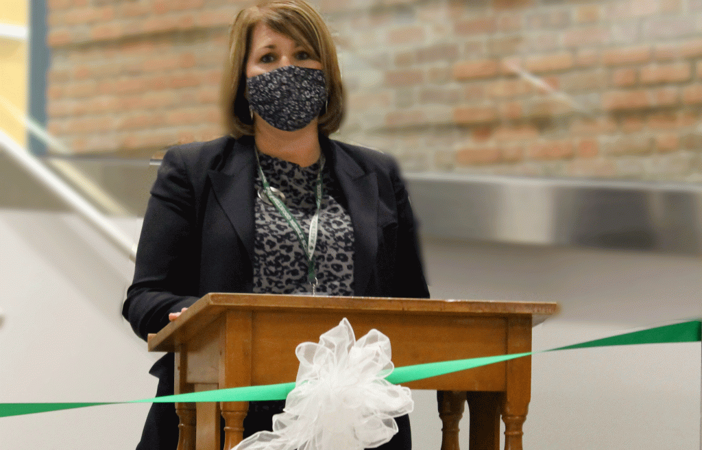 This is an image of the Wellwood Middle School principal speaking at a podium