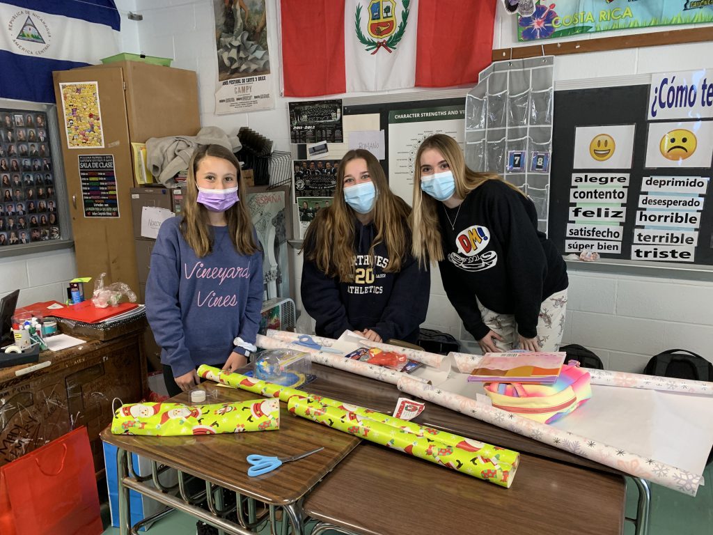 This is an image of three high school students standing together