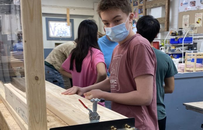 A student working on a bunk bed project.