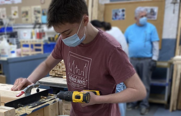 This is an image of a student using tools