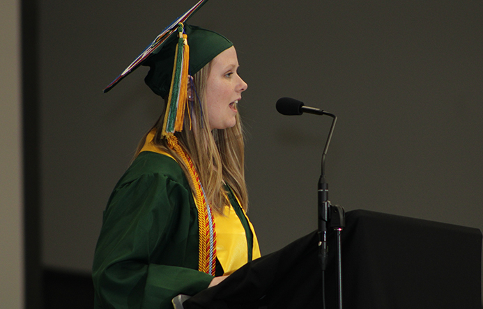 A student speaking at graduation.