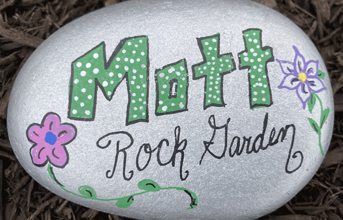 A painted rock that reads "Mott Rock Garden".