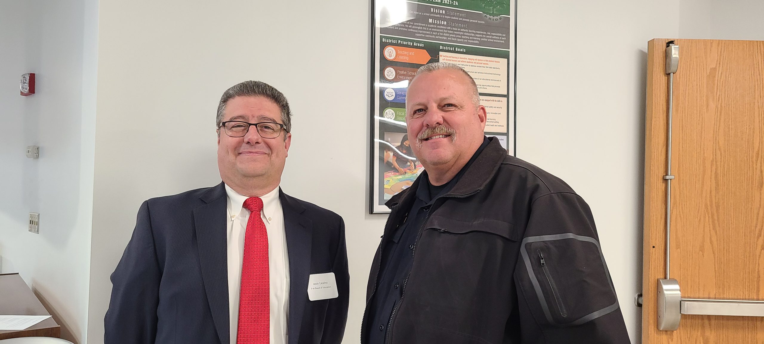 Jason Catalino and Michael Crowell smile for a photo