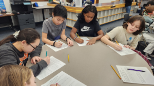 Students taking part in a writing exercise.