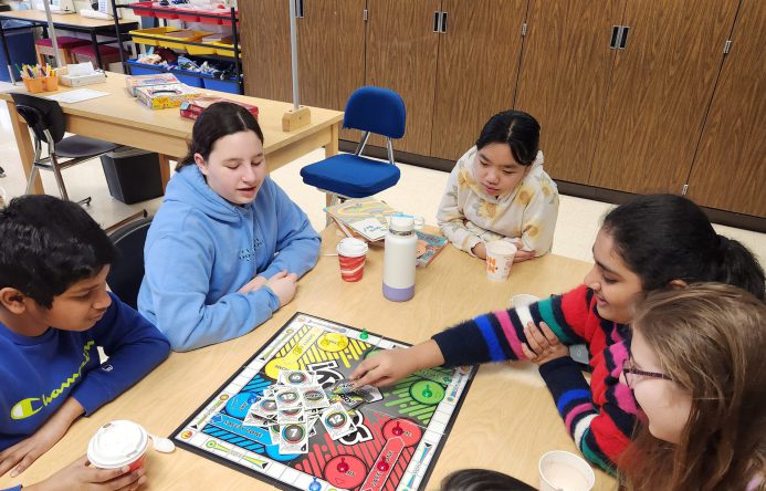 Students playing the board game Sorry