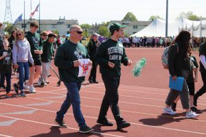 Two members of the F-M community are pictured during the parade of champions