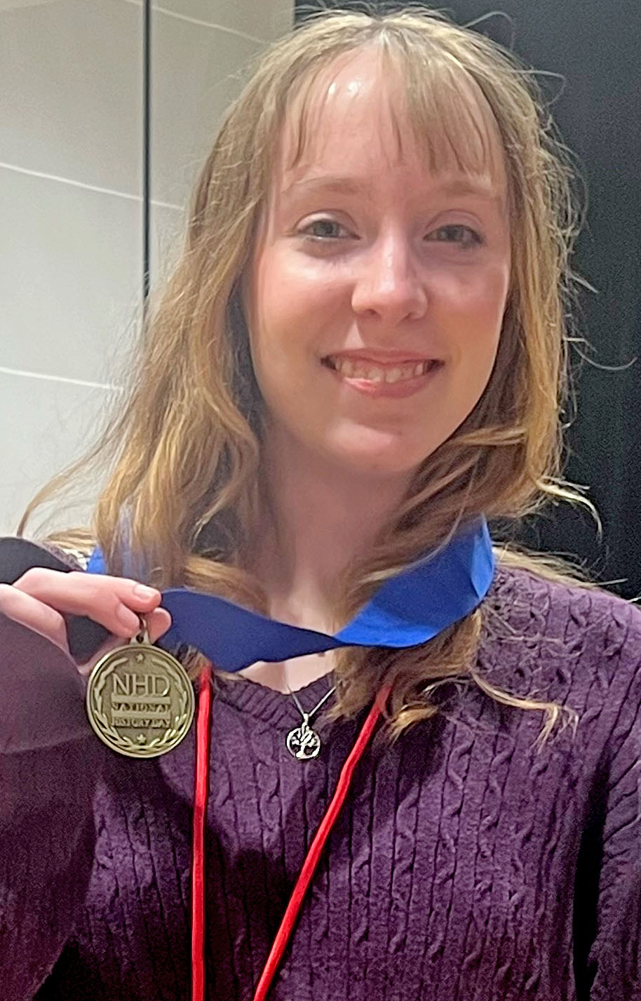 Mae Cohen holds her National History Day medal