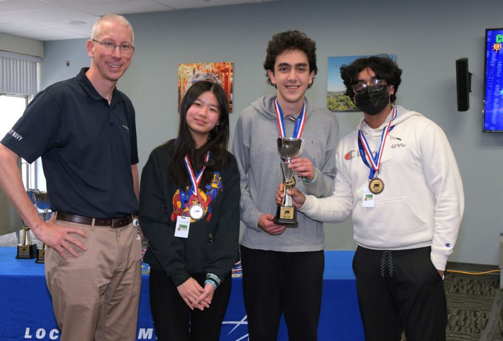 The three F-M Code Quest winners pose for a photo