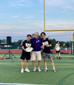 A phoot of a teacher (Dr. Kilmer) with two students Anthony and Stephen, after having a pie thrown in his face.