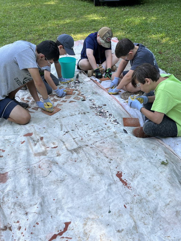 Middle school students participate in Archaeology Camp during July of 2023.